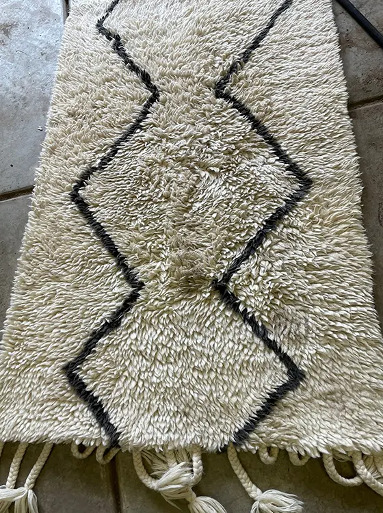 Detail of the same wool rug's texture after cleaning